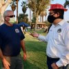 Lemoore Volunteer Fire Chief Bruce German has a chat with Assemblyman Rudy Salas.